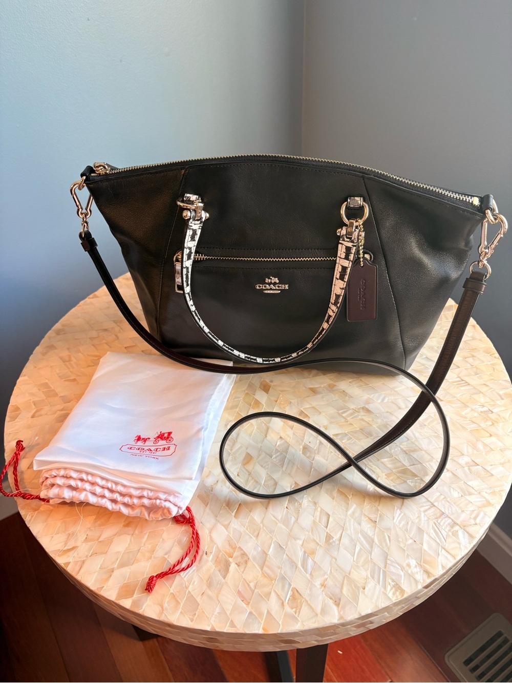 Coach Black Leather Handbag with Printed Handle Accents and Crossbody Strap